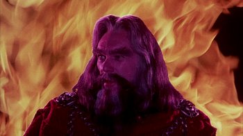 Movie still from “The Island at the Top of the World” (1974), directed by Robert Stevenson – A man with long hair and a long beard; Close Up shot, Low angle