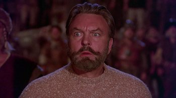 Movie still from “The Island at the Top of the World” (1974), directed by Robert Stevenson – A man with a beard and a mustache looking at the camera; Close Up shot, Low angle