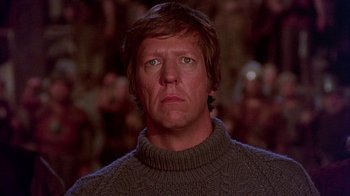 Movie still from “The Island at the Top of the World” (1974), directed by Robert Stevenson – A person wearing a sweater; Close Up shot, Low angle