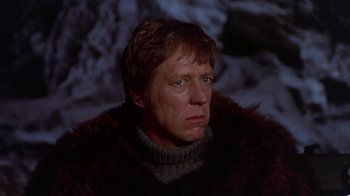 Movie still from “The Island at the Top of the World” (1974), directed by Robert Stevenson – A person wearing a fur coat; Close Up shot, Low angle
