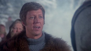 Movie still from “The Island at the Top of the World” (1974), directed by Robert Stevenson – A person wearing a fur coat; Close Up shot, Over the shoulder angle