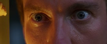 Movie still from “The Island of Dr. Moreau” (1996), directed by Richard Stanley – View of a man's eyes; Extreme Close Up shot, Overhead angle