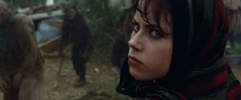 Movie still from “The Island of Dr. Moreau” (1996), directed by Richard Stanley – A person looking at the camera; Close Up shot, Over the shoulder angle