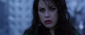 Movie still from “The Island of Dr. Moreau” (1996), directed by Richard Stanley – A person with blue eyes; Close Up shot, Over the shoulder angle