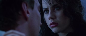 Movie still from “The Island of Dr. Moreau” (1996), directed by Richard Stanley – A person looking at the camera; Close Up shot, Over the shoulder angle