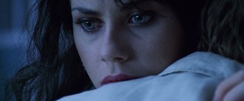 Movie still from “The Island of Dr. Moreau” (1996), directed by Richard Stanley – A woman's eyes and face; Extreme Close Up shot, High angle