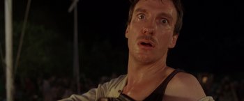 Movie still from “The Island of Dr. Moreau” (1996), directed by Richard Stanley – A person with a wet shirt on; Close Up shot, Low angle