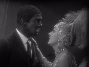 Movie still from “The Jazz Singer” (1927), directed by Alan Crosland – A black and white photo of a man and a woman; Close Up shot, High angle