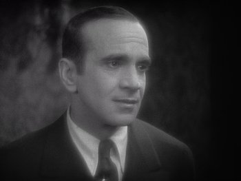 Movie still from “The Jazz Singer” (1927), directed by Alan Crosland – An older man wearing a suit and a tie; Close Up shot, High angle