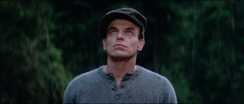 Movie still from “The Journey of Natty Gann” (1985), directed by Jeremy Kagan – A person wearing a hat; Close Up shot, Low angle