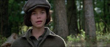 Movie still from “The Journey of Natty Gann” (1985), directed by Jeremy Kagan – A young girl wearing a hat and a jacket; Close Up shot, High angle