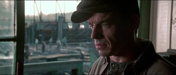 Movie still from “The Journey of Natty Gann” (1985), directed by Jeremy Kagan – A person wearing a hat; Close Up shot, Over the shoulder angle