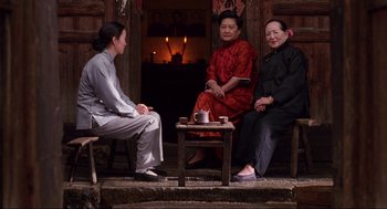 Movie still from “The Joy Luck Club” (1993), directed by Wayne Wang – A group of women sitting around a table; Wide shot, Over the shoulder angle