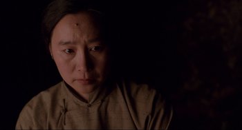 Movie still from “The Joy Luck Club” (1993), directed by Wayne Wang – A woman with a black spot on her forehead; Close Up shot, High angle