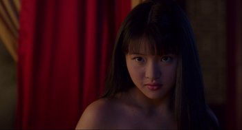 Movie still from “The Joy Luck Club” (1993), directed by Wayne Wang – A young woman with long black hair is looking at the camera; Close Up shot, Low angle