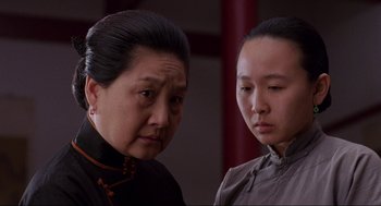Movie still from “The Joy Luck Club” (1993), directed by Wayne Wang – A woman and a young girl looking at each other; Close Up shot, Low angle