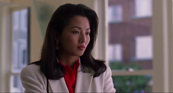 Movie still from “The Joy Luck Club” (1993), directed by Wayne Wang – A woman in a white jacket and a red shirt; Close Up shot, Low angle