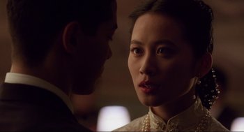 Movie still from “The Joy Luck Club” (1993), directed by Wayne Wang – A young man and a young woman looking at one another; Close Up shot, Over the shoulder angle