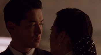 Movie still from “The Joy Luck Club” (1993), directed by Wayne Wang – A man and a woman face to face in the dark; Close Up shot, Over the shoulder angle