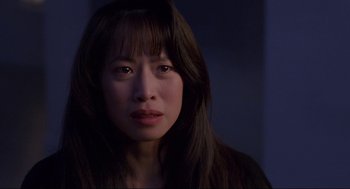 Movie still from “The Joy Luck Club” (1993), directed by Wayne Wang – A person with long brown hair; Close Up shot, Over the shoulder angle