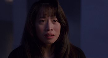 Movie still from “The Joy Luck Club” (1993), directed by Wayne Wang – A person with long brown hair; Close Up shot, Over the shoulder angle