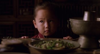 Movie still from “The Joy Luck Club” (1993), directed by Wayne Wang – A young child sitting in front of a plate of food; Close Up shot, High angle