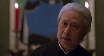 Movie still from “The Joy Luck Club” (1993), directed by Wayne Wang – An older man with white hair looking at the camera; Close Up shot, Low angle