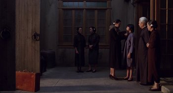 Movie still from “The Joy Luck Club” (1993), directed by Wayne Wang – A group of women standing in front of a building; Wide shot, High angle