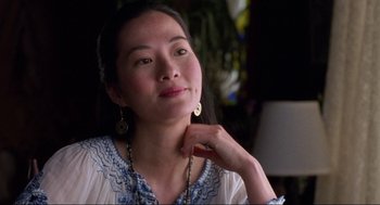Movie still from “The Joy Luck Club” (1993), directed by Wayne Wang – A woman sitting in front of a window with her hand under her chin; Close Up shot, Over the shoulder angle