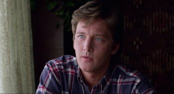 Movie still from “The Joy Luck Club” (1993), directed by Wayne Wang – A young man with blue eyes wearing a plaid shirt; Close Up shot, Low angle