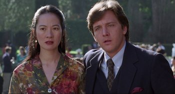 Movie still from “The Joy Luck Club” (1993), directed by Wayne Wang – A man and a woman standing next to each other; Close Up shot, Over the shoulder angle