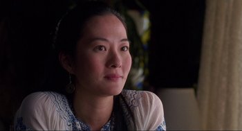 Movie still from “The Joy Luck Club” (1993), directed by Wayne Wang – A person sitting in front of a window; Close Up shot, Over the shoulder angle