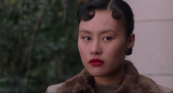 Movie still from “The Joy Luck Club” (1993), directed by Wayne Wang – A person wearing a coat; Close Up shot, Over the shoulder angle