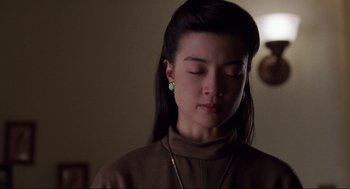 Movie still from “The Joy Luck Club” (1993), directed by Wayne Wang – A woman with her eyes closed with her eyes closed; Close Up shot, Low angle