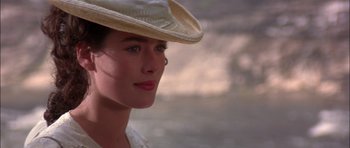 Movie still from “The Jungle Book” (1994), directed by Stephen Sommers – A person wearing a hat; Close Up shot, Over the shoulder angle