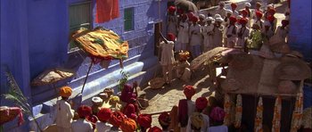 Movie still from “The Jungle Book” (1994), directed by Stephen Sommers – A group of men in white clothes and red turbans; Extreme Wide shot, High angle