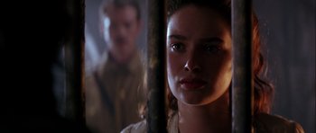 Movie still from “The Jungle Book” (1994), directed by Stephen Sommers – A young woman standing in front of a man; Close Up shot, Over the shoulder angle