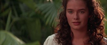 Movie still from “The Jungle Book” (1994), directed by Stephen Sommers – A person with long curly hair; Close Up shot, Over the shoulder angle