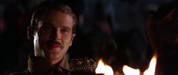 Movie still from “The Jungle Book” (1994), directed by Stephen Sommers – A person wearing a uniform; Close Up shot, Low angle