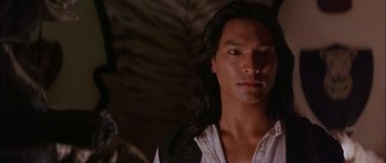 Movie still from “The Jungle Book” (1994), directed by Stephen Sommers – A person with long black hair; Close Up shot, Over the shoulder angle