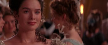 Movie still from “The Jungle Book” (1994), directed by Stephen Sommers – A woman in a dress and a woman in a gown; Close Up shot, Over the shoulder angle