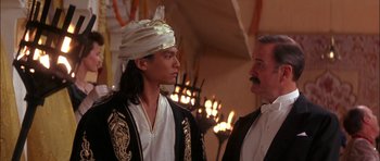 Movie still from “The Jungle Book” (1994), directed by Stephen Sommers – A man and a man wearing a turban; Close Up shot, Over the shoulder angle