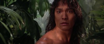 Movie still from “The Jungle Book” (1994), directed by Stephen Sommers – A person with long black hair; Close Up shot, Low angle