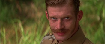 Movie still from “The Jungle Book” (1994), directed by Stephen Sommers – A person with a mustache; Close Up shot, Low angle