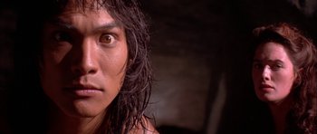 Movie still from “The Jungle Book” (1994), directed by Stephen Sommers – A person's face with long hair; Close Up shot, Low angle