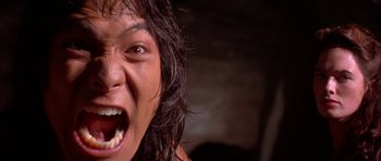 Movie still from “The Jungle Book” (1994), directed by Stephen Sommers – A person with a mouth open; Extreme Close Up shot, Low angle
