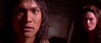 Movie still from “The Jungle Book” (1994), directed by Stephen Sommers – A person's face with long hair; Close Up shot, Low angle