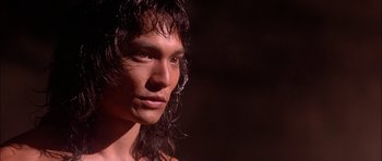 Movie still from “The Jungle Book” (1994), directed by Stephen Sommers – A person with long hair; Close Up shot, Low angle