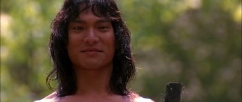 Movie still from “The Jungle Book” (1994), directed by Stephen Sommers – A person with long black hair; Close Up shot, Low angle