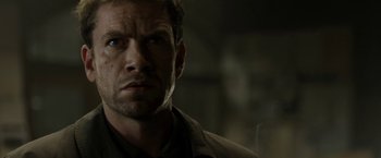 Movie still from “Department Q: The Keeper of Lost Causes” (2013), directed by Mikkel Nørgaard – A person wearing a jacket; Close Up shot, Low angle